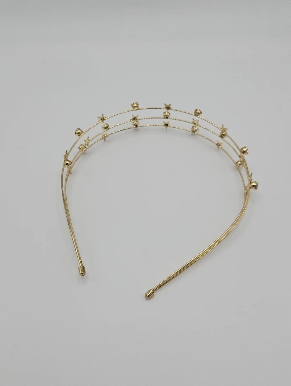 gold tone wire headband with stars and rhinestones